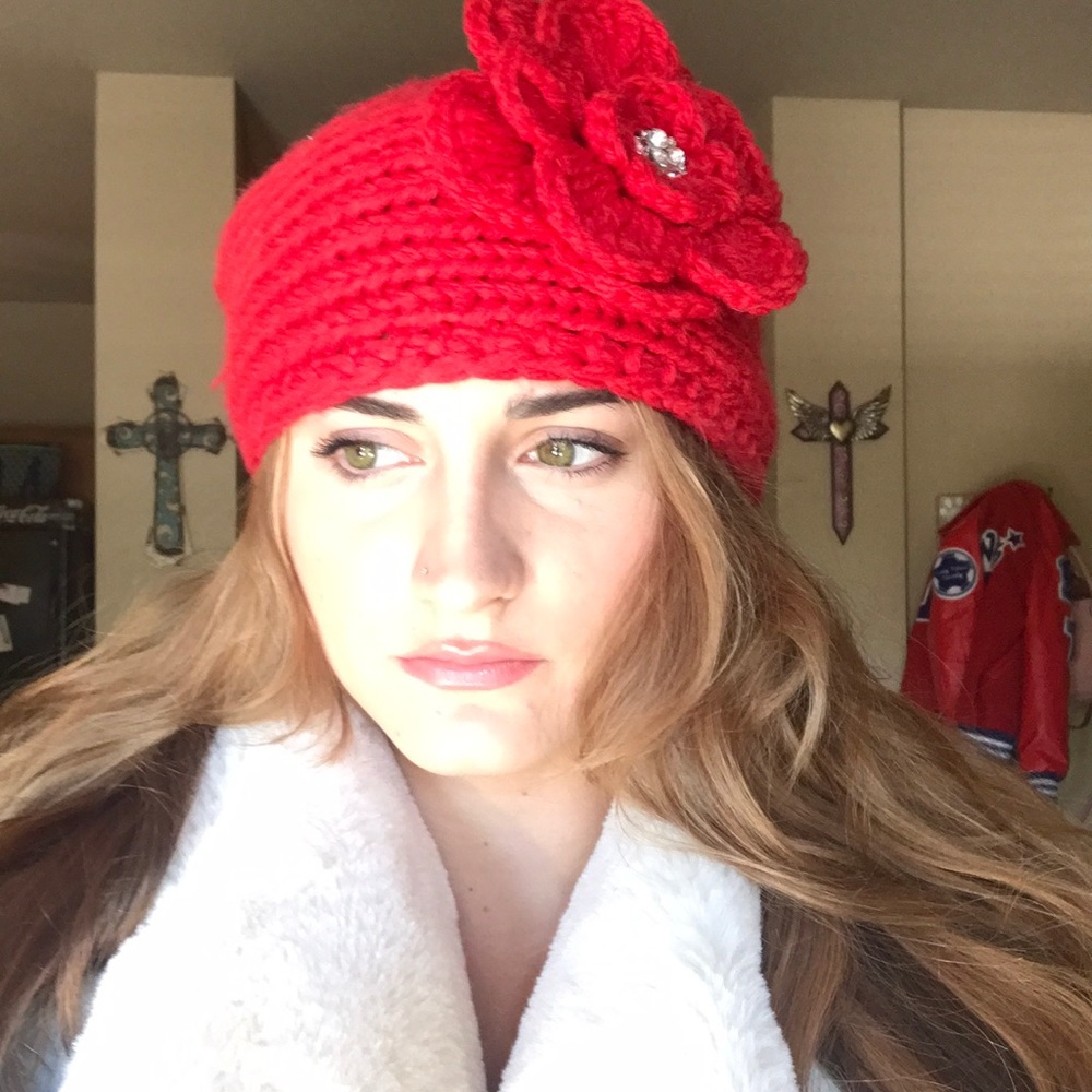 Red knitted flower ear muffs